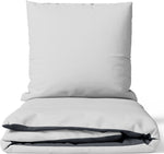 Baumwoll-Satin Wendebettwäsche-Set in Grau und Anthrazit – edle Optik mit verdecktem Reißverschluss, Kissen und Decke aufeinandergelegt.