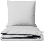 Baumwoll-Satin Wendebettwäsche-Set in Grau und Anthrazit – edle Optik mit verdecktem Reißverschluss, Kissen und Decke aufeinandergelegt.