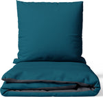 Wendebettwäsche-Set in Petrol und Anthrazit aus 100% Baumwolle – Kissenbezug und Deckenbezug auf weißem Hintergrund, beidseitig nutzbar