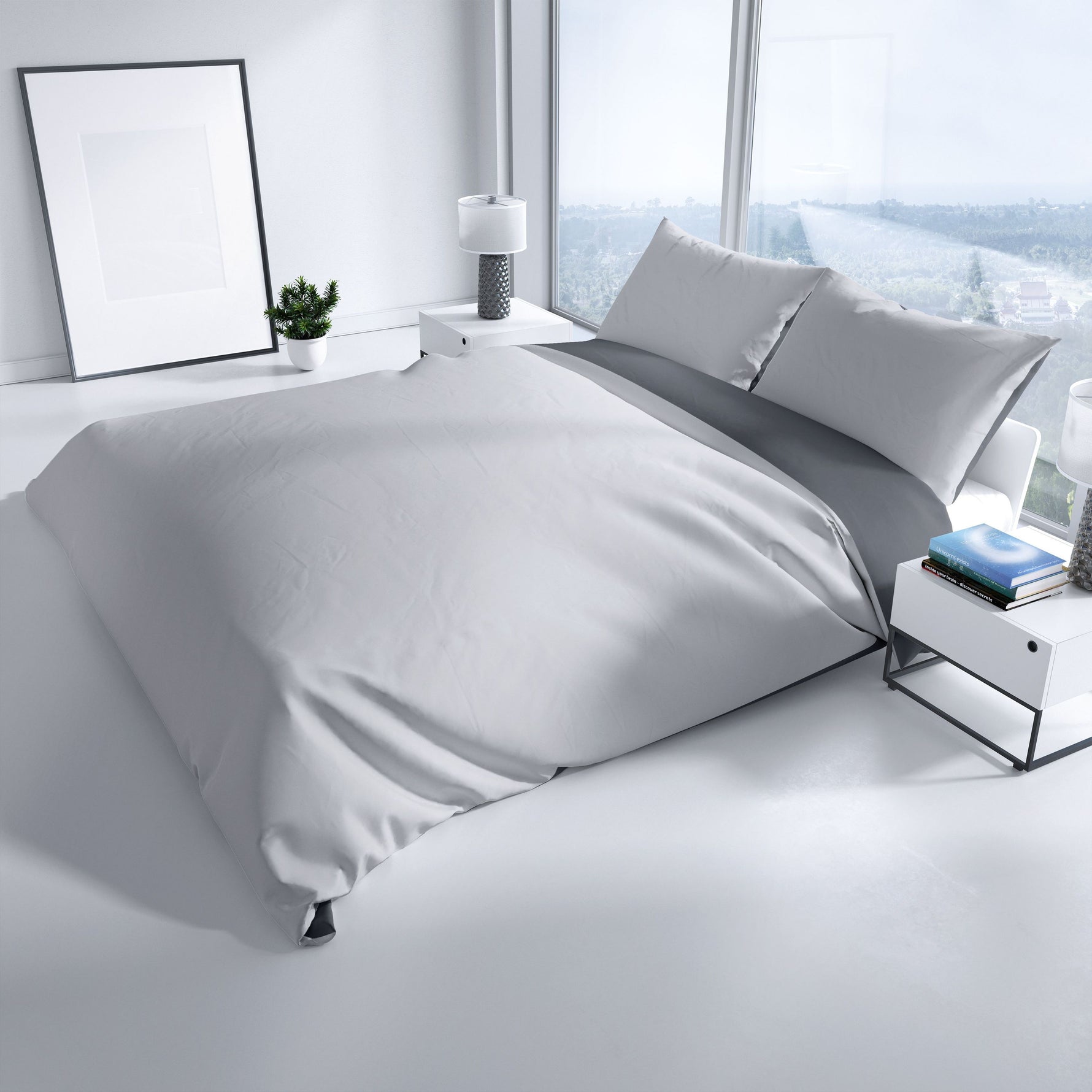 Modern eingerichtetes Schlafzimmer mit eleganter Wendebettwäsche in Grau und Anthrazit von Leonado Vicenti – perfekte Kombination aus Stil und Komfort.